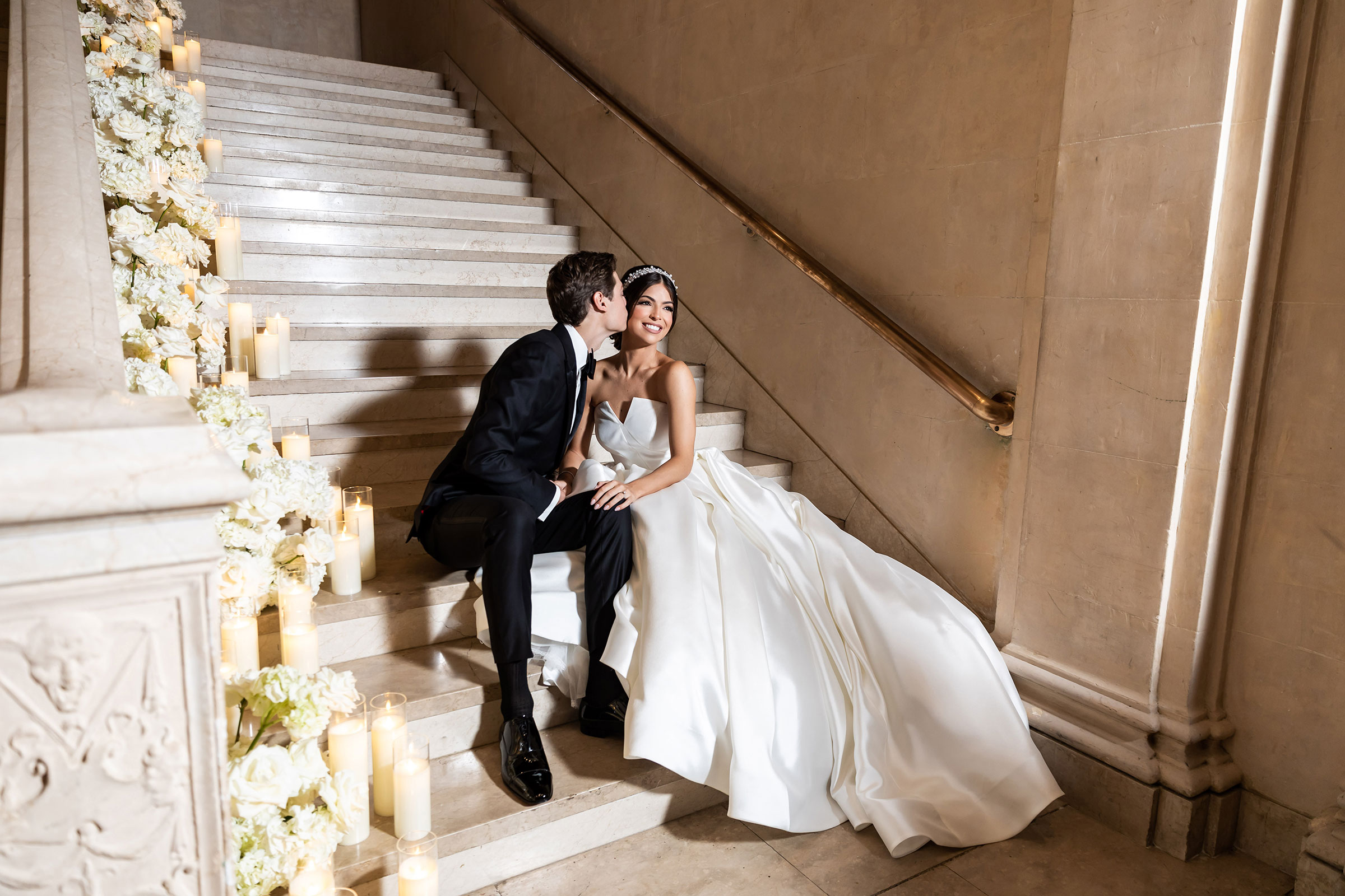 Glamorous staircase wedding scene with candles and flowers