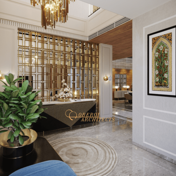 Reception and entrance area branded as Oberoi Architects with geometric screen and chandelier
