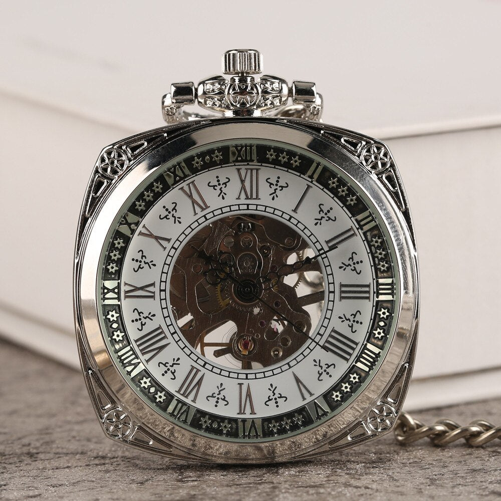 Silver ornate vintage pocket watch with skeleton mechanism and Roman numerals