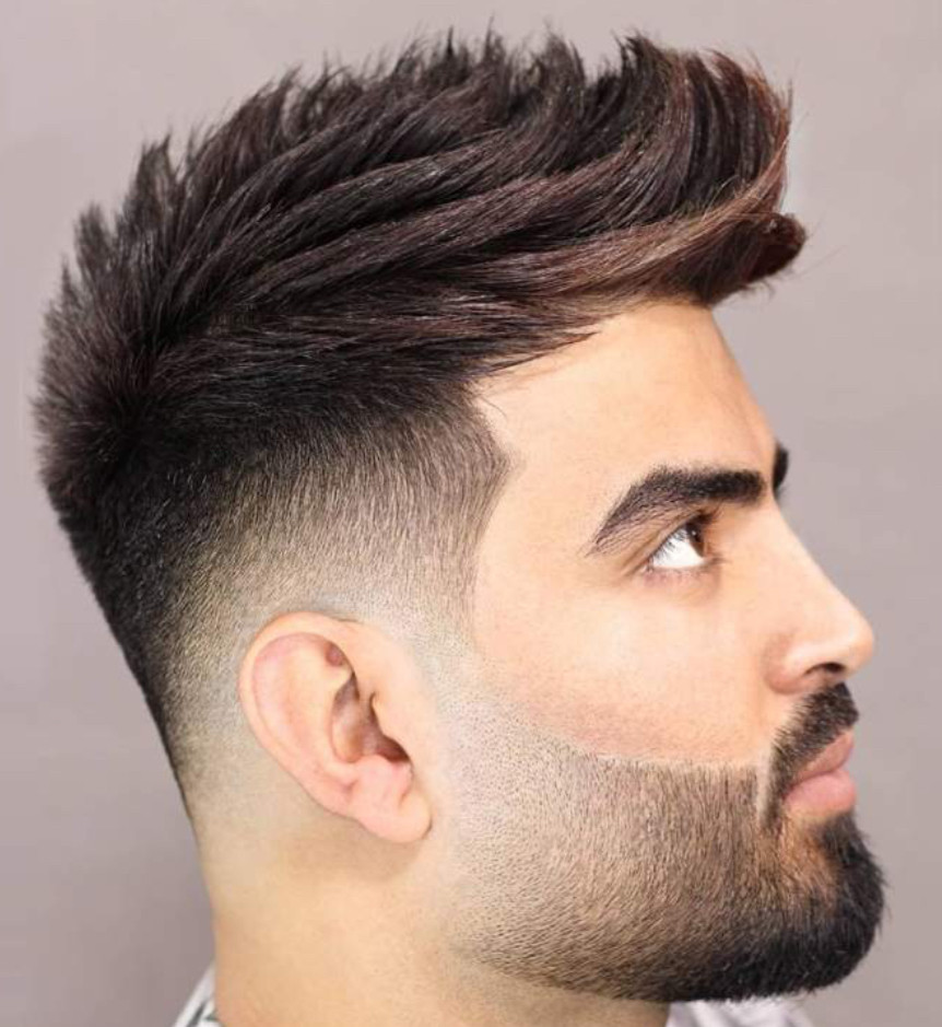 Side profile with spiky modern haircut and groomed beard